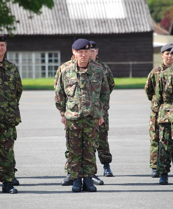 A soldier waits in the ranks