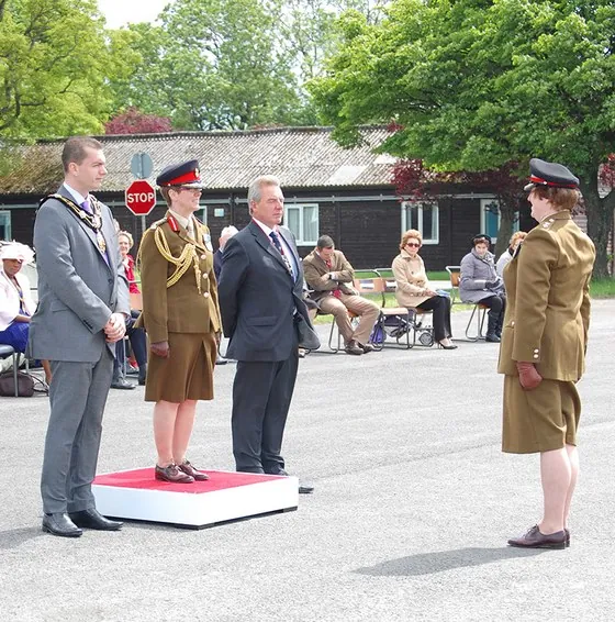 Guests and an officer on the dais