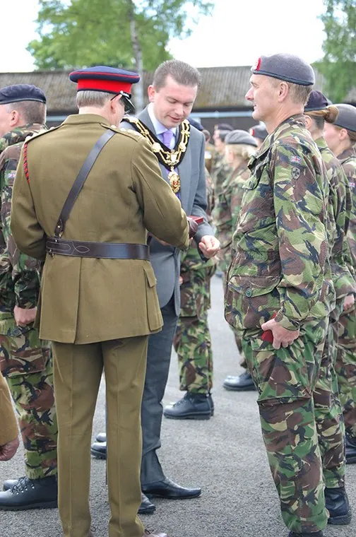 Officers and guests move along the ranks