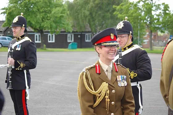 An officer with members of the band