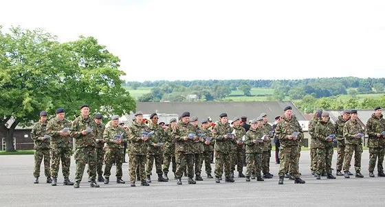Soldiers on the square with booklets in hand